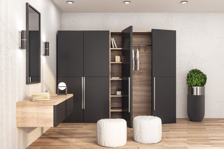 Modern wardrobe with clothes in stylish interior